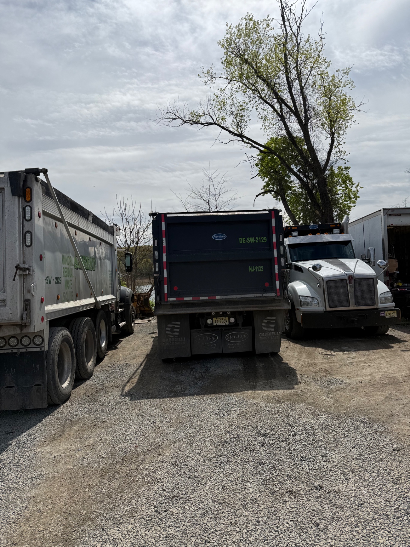 Sebest Inc dump truck fleet at the yard