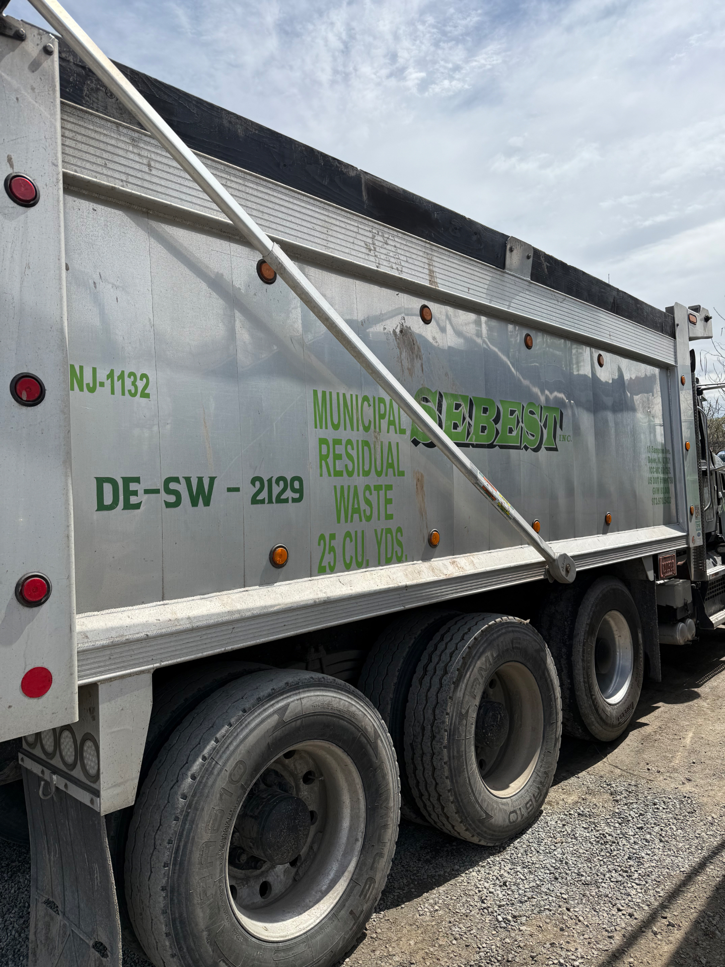 Sebest Inc Municipal Residual Waste dump truck side view